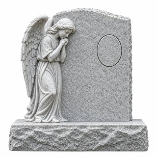 Granite angel headstone with praying angel sculpture and custom portrait area for a cemetery memorial