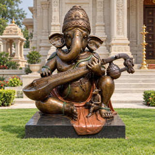 Antique bronze Ganesha statue seated and playing a Indian veena in a traditional Hindu temple courtyard. VSB-170