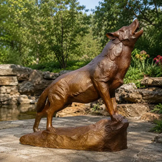 Bronze howling wolf sculpture standing on a textured rocky base with detailed wildlife features VSB-161