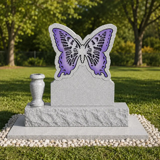 Butterfly gravestone with a granite memorial flower vase, purple wing design and upright cemetery monument