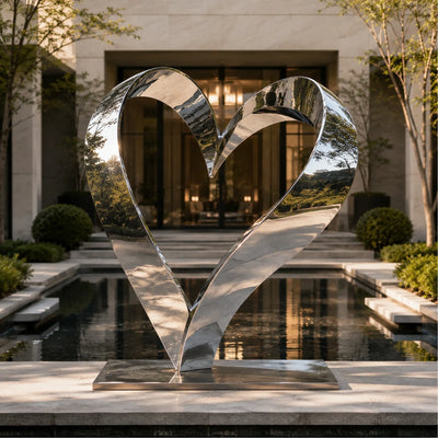 Outdoor romantic stainless steel heart statue with mirror finish for wedding venues, resorts, and luxury gardens.