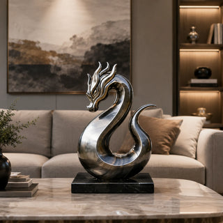Modern dragon sculpture installed at table desk with reflective mirror finish metal surface