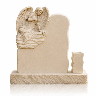Hand carved marble angel headstone in warm beige stone designed as a personalized cemetery memorial