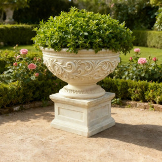 European-style marble planter with elegant scroll patterns for garden and outdoor landscape décor.