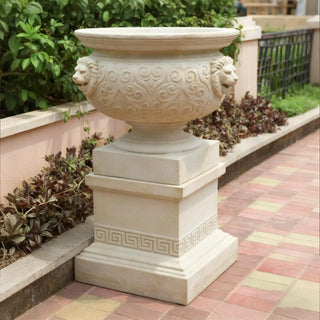 Marble planter with carved lion head, ideal for European courtyards and luxury outdoor garden décor.