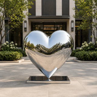 Large outdoor heart sculpture in polished stainless steel for modern gardens and landscaped courtyards