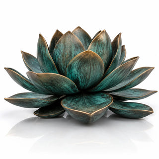 Bronze lotus sculpture displayed in a reflecting pool as a centerpiece for luxury courtyard landscaping