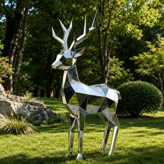 Contemporary stainless steel deer sculpture placed in landscaped garden as a modern metal artwork