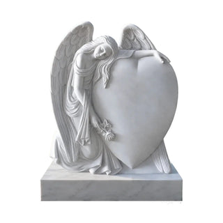 VICTORY white marble angel statue with heart, serving as a memorial monument in a cemetery.
