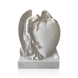 VICTORY white marble angel statue with heart, serving as a memorial monument in a cemetery.