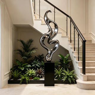 VICTORY Contemporary spiral stainless steel sculpture in luxury home or interior spaces.