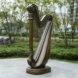 Vintage bronze harp statue used as musical art decor in music spaces and concert environments