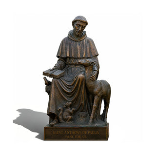 Outdoor bronze Saint Anthony statue installed at a chapel entrance and religious retreat center.