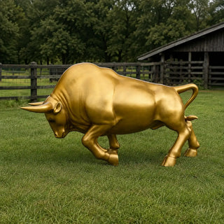Luxury bronze charging bull sculpture finished in metallic gold for hotels, office entrances and public plazas