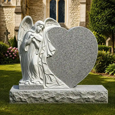 Gray granite angel heart headstone monument featuring a hand-carved guardian angel.