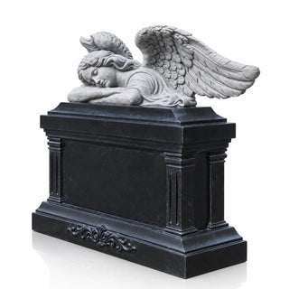 Sleeping angel headstone with detailed gray stone wings and a polished black marble memorial base