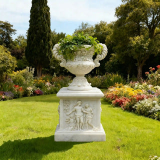 Hand-carved white marble planter with floral and grape relief, european design flowerpot for luxury garden décor.